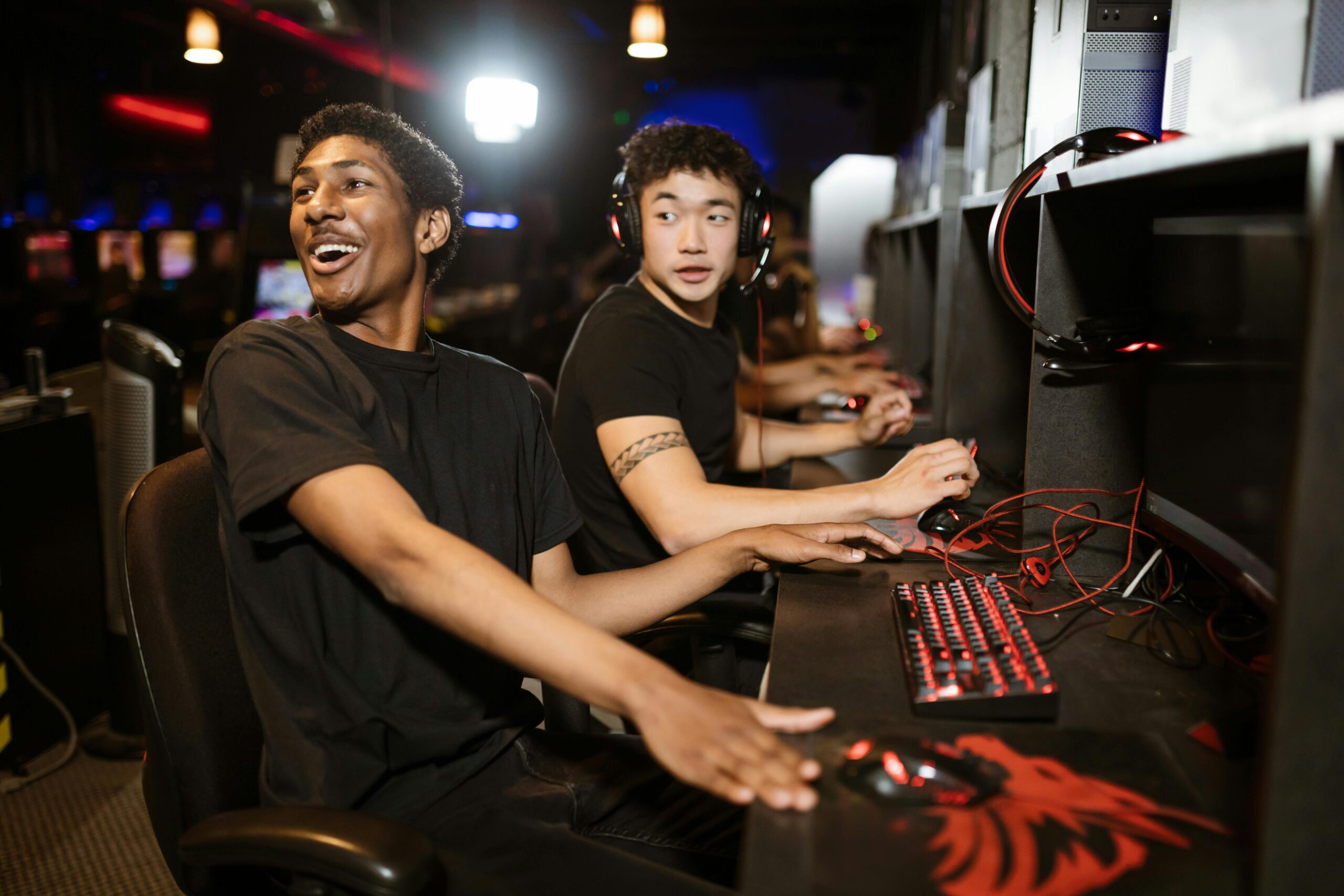 A group of diverse gamers playing e-sports in a vibrant arcade setting, showcasing friendship and joy.